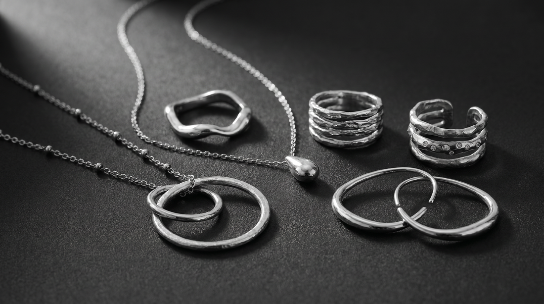 Layered textured jewellery in black and white close-up photography.