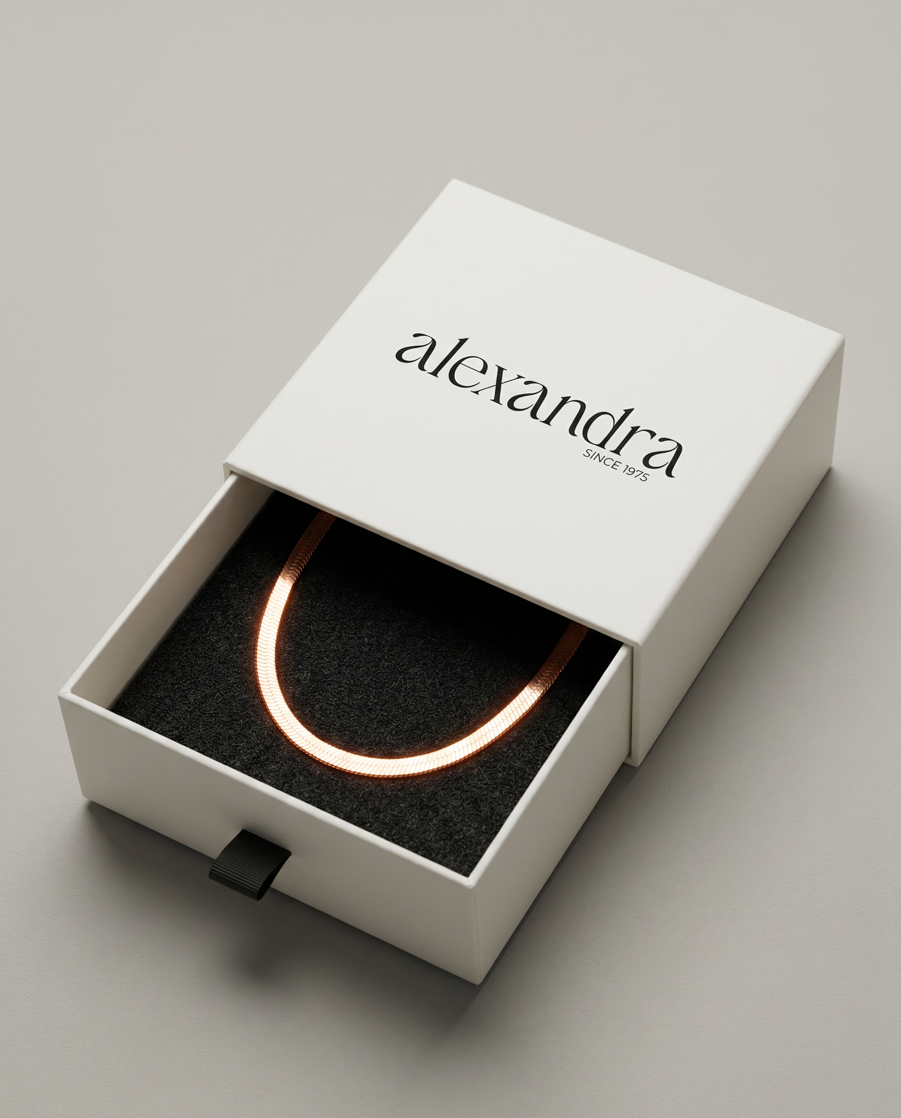 Sculptured rose gold Necklace in a 'alexandra' branded box on a light grey background