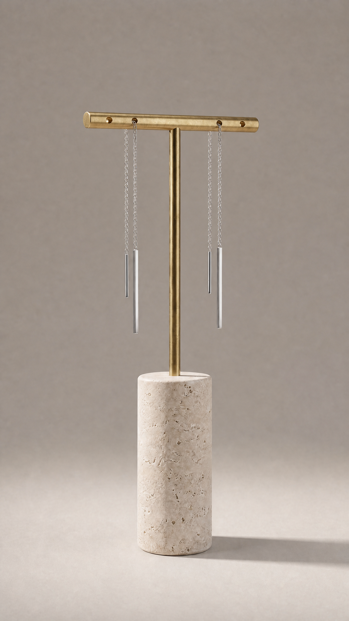 Delicate Silver Strand Earrings on a marble stand