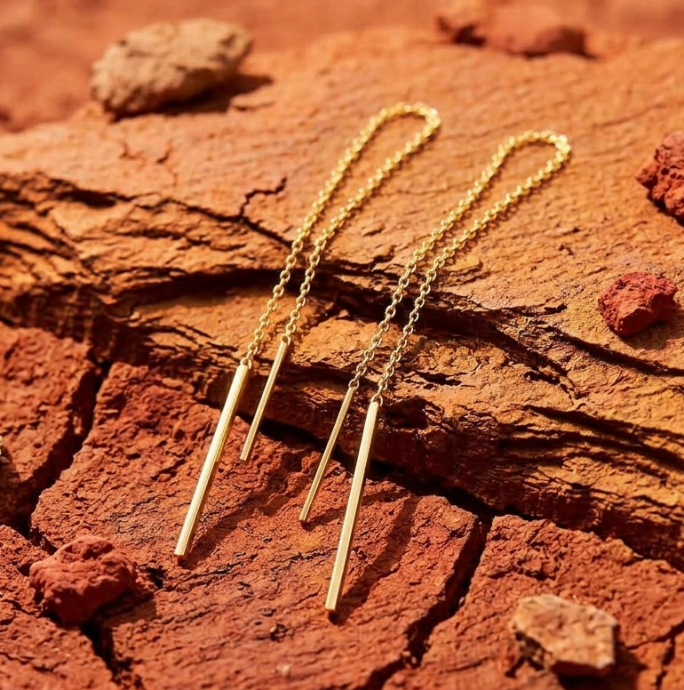 Minimalist earrings Australia, thread earrings on a red earth background